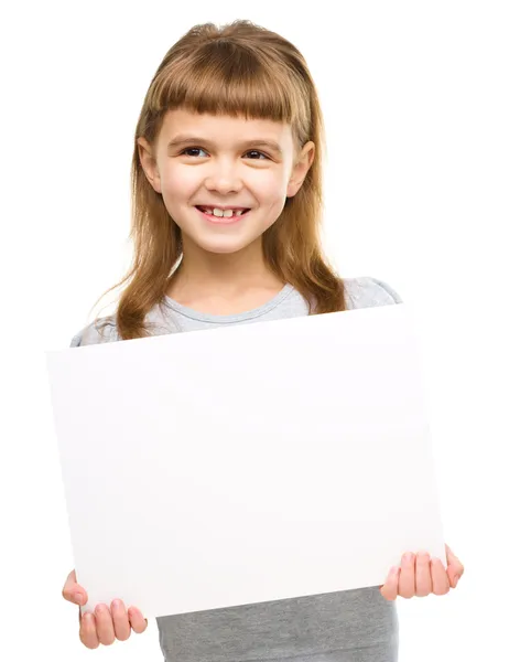 Little girl is holding blank banner — Stock Photo, Image