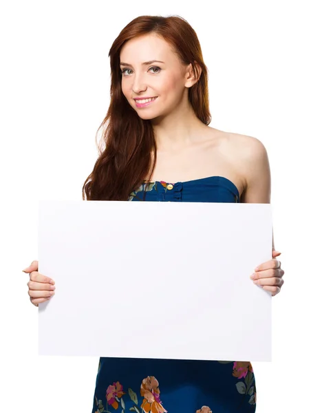 Young woman is holding blank banner — Stock Photo, Image