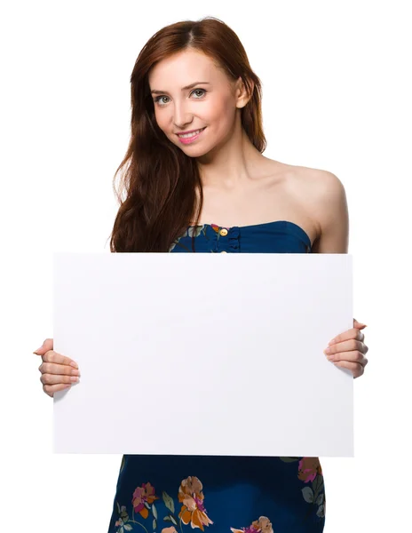 Young woman is holding blank banner — Stock Photo, Image