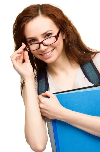 Joven estudiante chica está sosteniendo libro —  Fotos de Stock