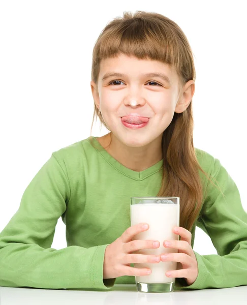 Cute little girl showing milk moustache — Stock Photo, Image