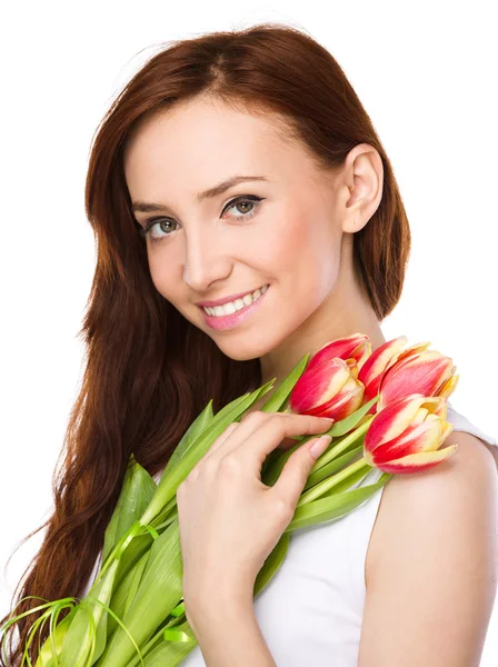 Young woman is holding bouquet of tulips — Stock Photo, Image