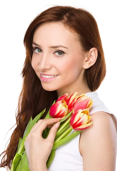 Young woman is holding bouquet of tulips — Stock Photo, Image