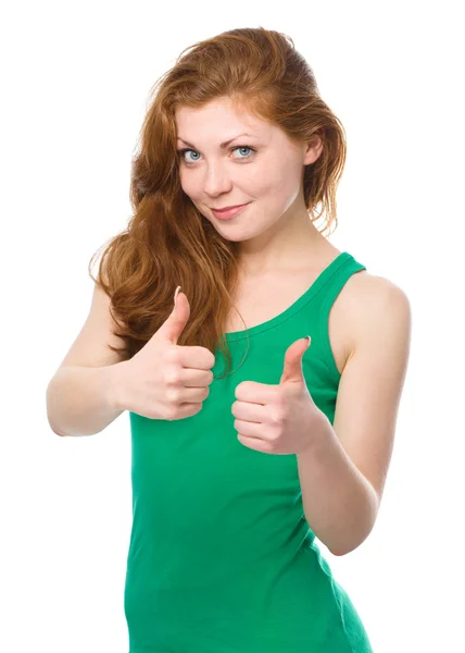 Woman is showing thumb up gesture — Stock Photo, Image