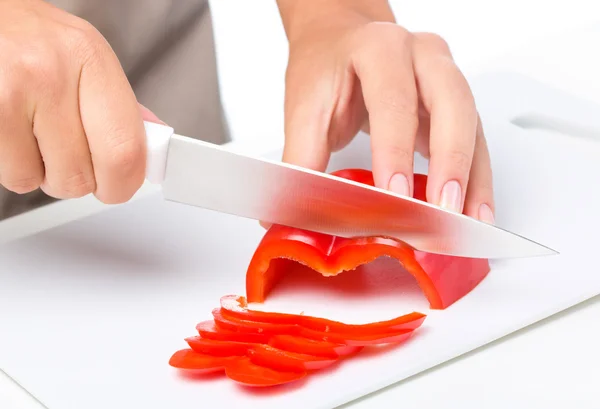 Cook is chopping bell pepper — Stock Photo, Image
