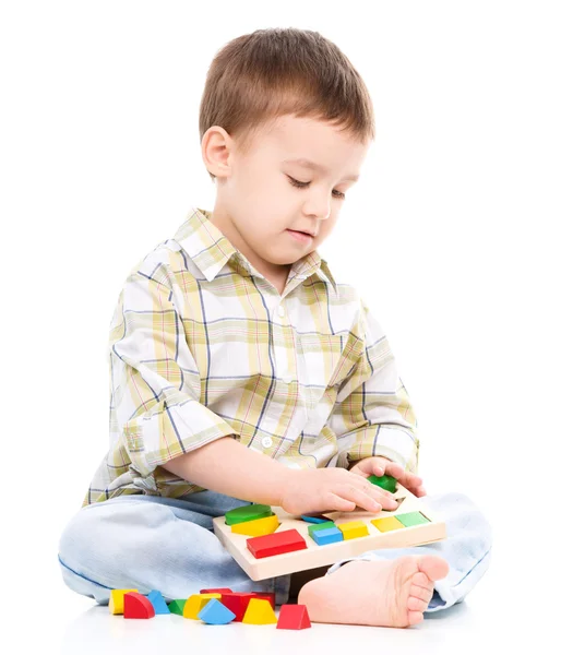 Little boy is playing with toys Royalty Free Stock Photos