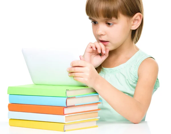 Young girl is using tablet while studying — Stock Photo, Image