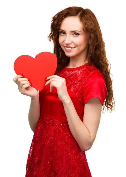 Young woman holding red heart — Stock Photo, Image