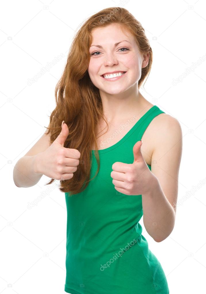 Woman is showing thumb up gesture