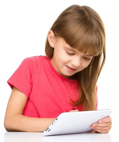 Young girl is using tablet — Stock Photo, Image