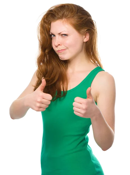 Woman is showing thumb up gesture — Stock Photo, Image