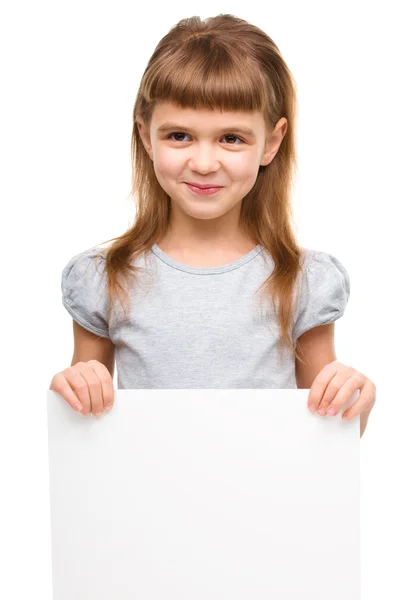 Little girl is holding blank banner — Stock Photo, Image