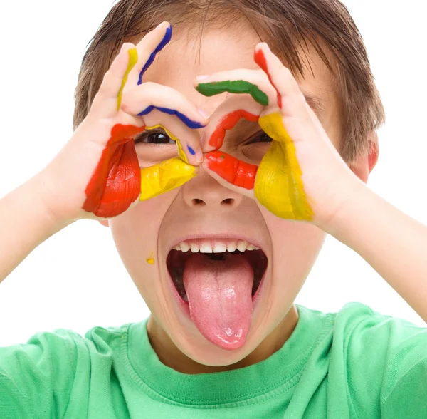 Portrait of a cute boy playing with paints — Stock Photo, Image