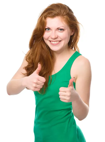 Woman is showing thumb up gesture — Stock Photo, Image