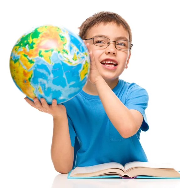 Little boy is holding globe — Stock Photo, Image