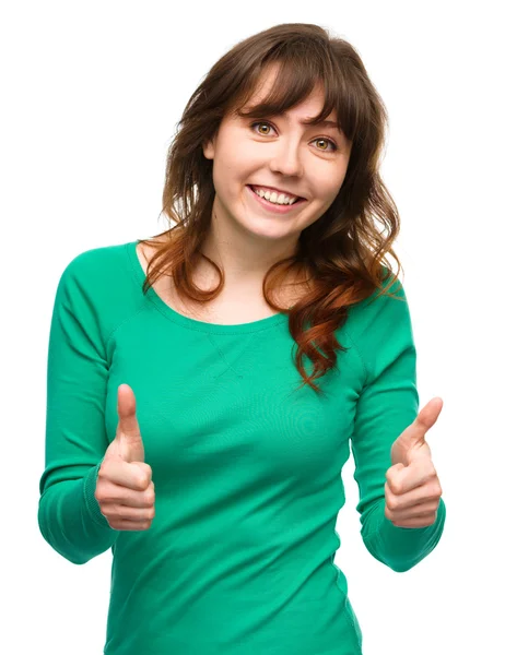 Woman is showing thumb up gesture — Stock Photo, Image