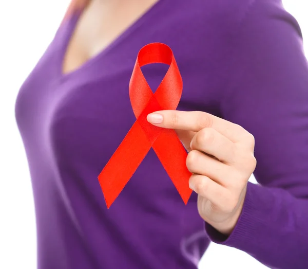 Woman is holding the red awareness ribbon — Stock Photo, Image