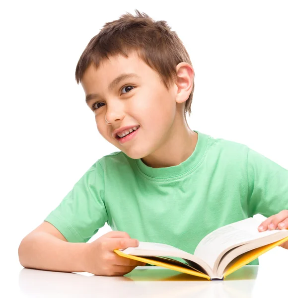 Little boy plays with book — Stock Photo, Image