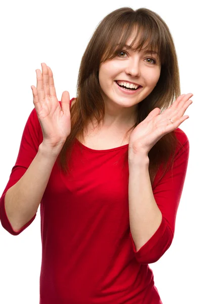 Woman is holding her face in astonishment — Stock Photo, Image