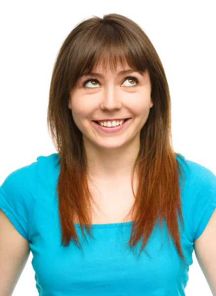 Young happy woman is looking up and smile — Stock Photo, Image