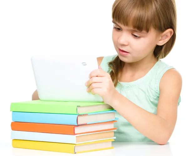 Young girl is using tablet — Stock Photo, Image