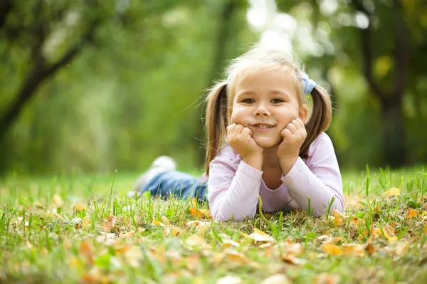 Portrait of a little girl in autumn park Stock Picture
