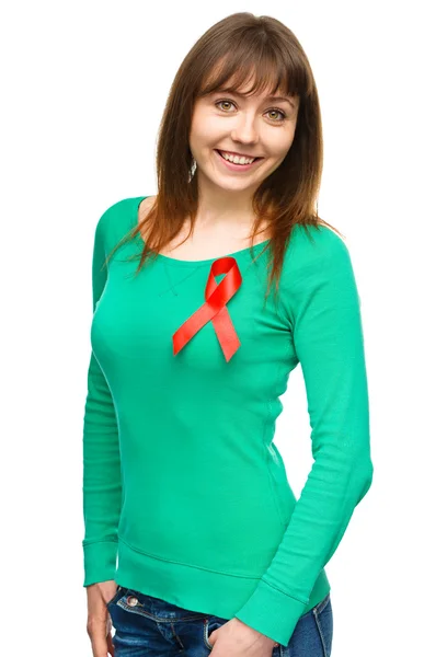 Woman with the red awareness ribbon — Stock Photo, Image