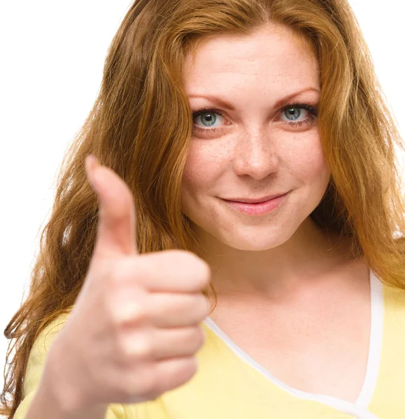 Woman is showing thumb up gesture — Stock Photo, Image