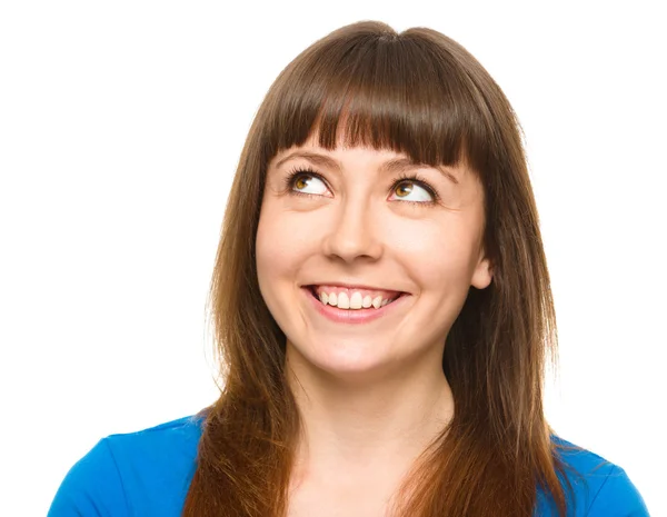 Young happy woman is looking up and smile — Stock Photo, Image