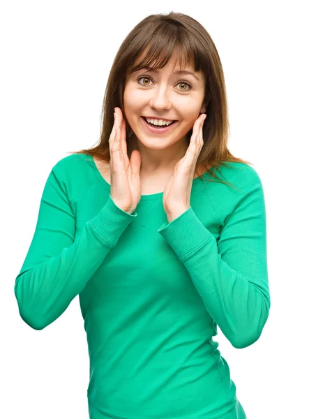 Woman is holding her face in astonishment — Stock Photo, Image