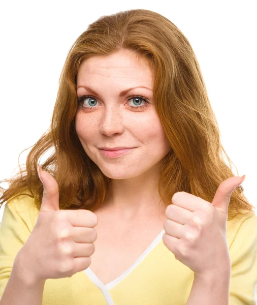 Woman is showing thumb up gesture — Stock Photo, Image