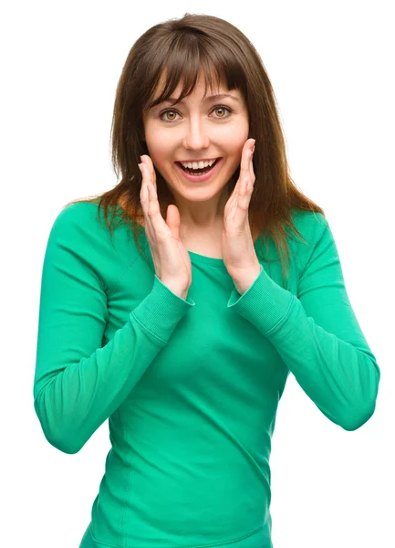 Woman is holding her face in astonishment — Stock Photo, Image