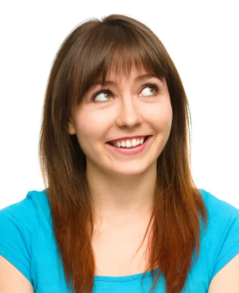 Young happy woman is looking up and smile — Stock Photo, Image