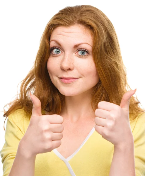 Woman is showing thumb up gesture — Stock Photo, Image