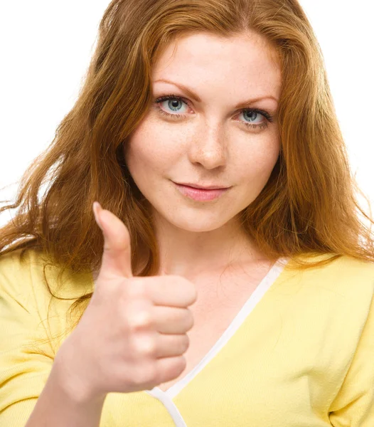 Woman is showing thumb up gesture — Stock Photo, Image