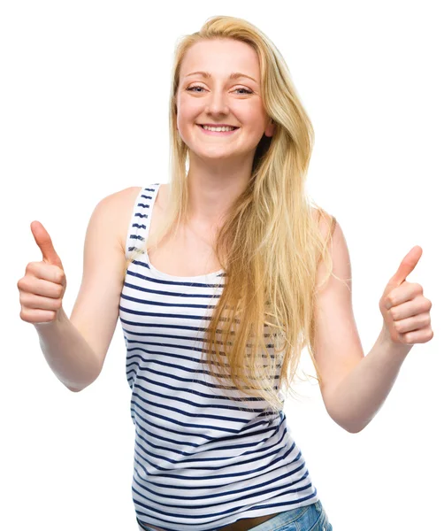 Young woman is showing thumb up gesture — Stock Photo, Image