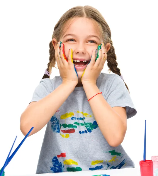 Little girl is holding her face in astonishment — Stock Photo, Image