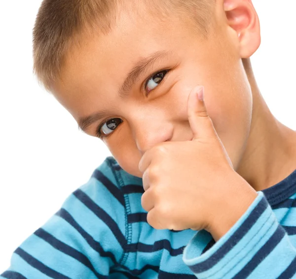 Niño pequeño está mostrando el pulgar hacia arriba signo —  Fotos de Stock