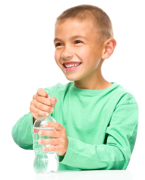 Boy with plastic bottle of water Stock Image