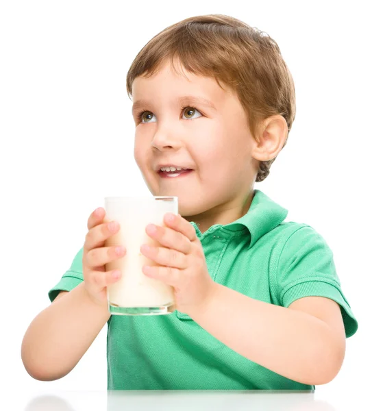 Cute little boy with a glass of milk Royalty Free Stock Photos