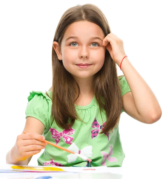 Little girl is painting with gouache Royalty Free Stock Images