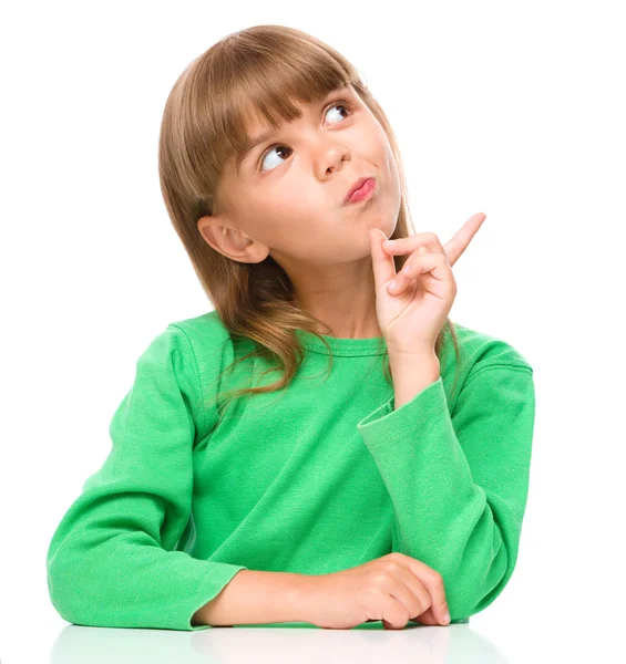 Portrait of a young girl pointing to the right — Stock Photo, Image