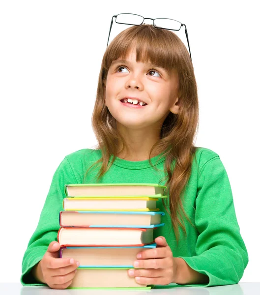 Little girl is reading a book — Stock Photo, Image