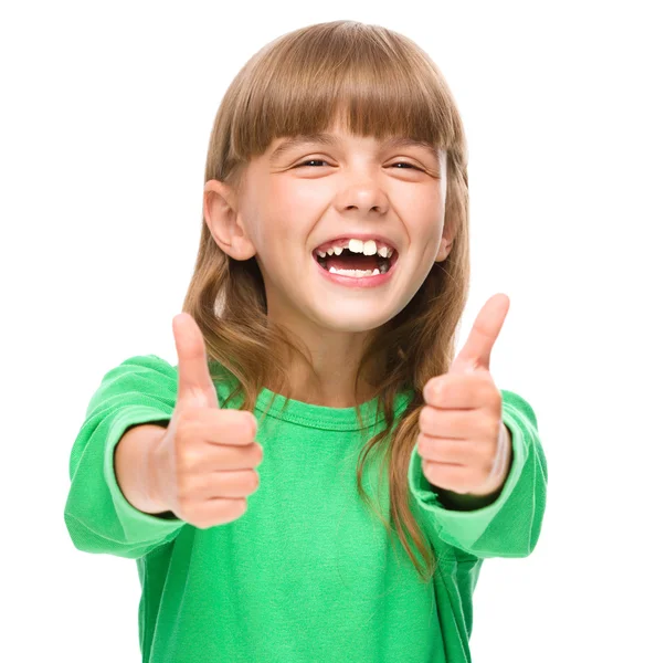 Little girl is showing thumb up sign — Stock Photo, Image