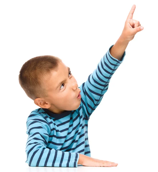 Little boy is pointing up using his index finger Stock Image
