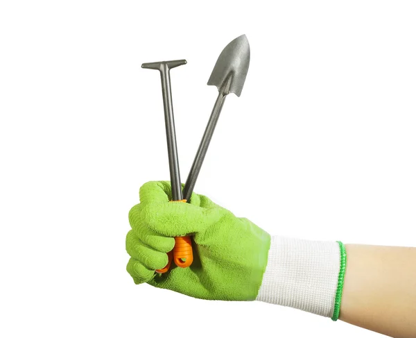 Hand in de handschoen houden grondwerk tools — Stockfoto