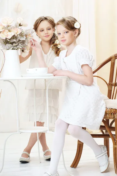 2 little sisters in cafe — Stock Photo, Image