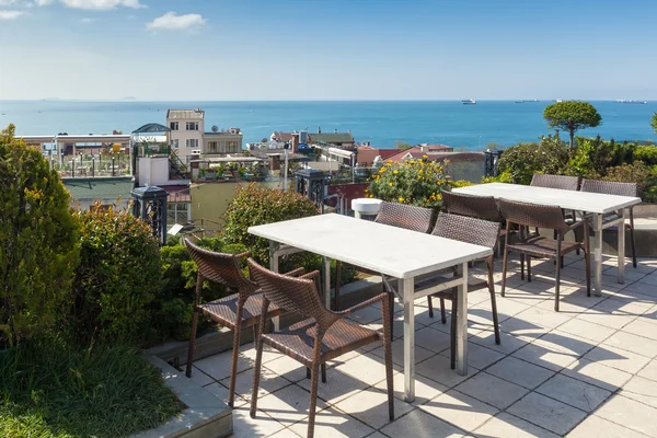 Empty cafe tables high over city and Marmara sea, Istanbul — Stock Photo, Image