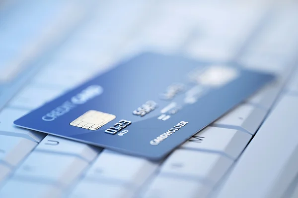 Credit card on computer keyboard — Stock Photo, Image