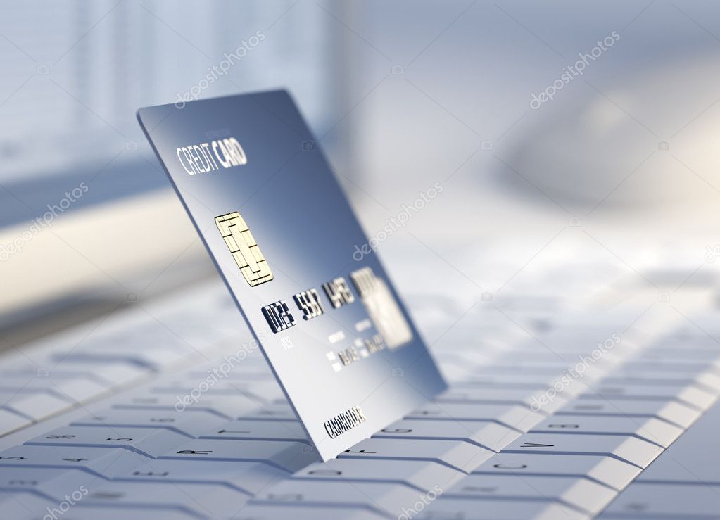 Credit card at desktop computer